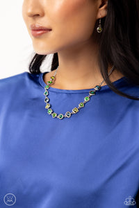 Featuring various shapes and shades of green, a collection of teardrop, round, heart, and square-cut gems in matching silver frames coalesce around the neckline for an abstract display of color and charm. Features an adjustable clasp closure.  Sold as one individual choker necklace. Includes one pair of matching earrings.