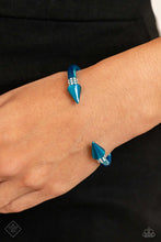 Load image into Gallery viewer,  Featuring a dusting of rows of white rhinestones, a metallic blue-hued cuff with tactile spikes meeting at the center of the wrist glimmers for a seasonal look.  Sold as one individual bracelet. 
