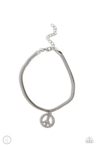 A silver peace sign infused with dazzling white rhinestones effortlessly slides along a thick silver snake chain, creating an irresistible pendant. Features an adjustable clasp closure. Sold as one individual anklet.