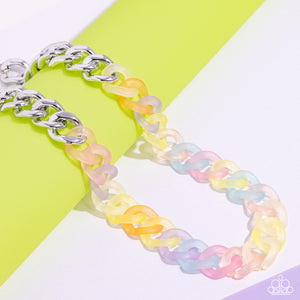 Featuring a kaleidoscope of colors, acrylic rings connect to high-sheen silver curb chain links for a magically multicolored display. Features an adjustable clasp closure. Sold as one individual necklace. Includes one pair of matching earrings.