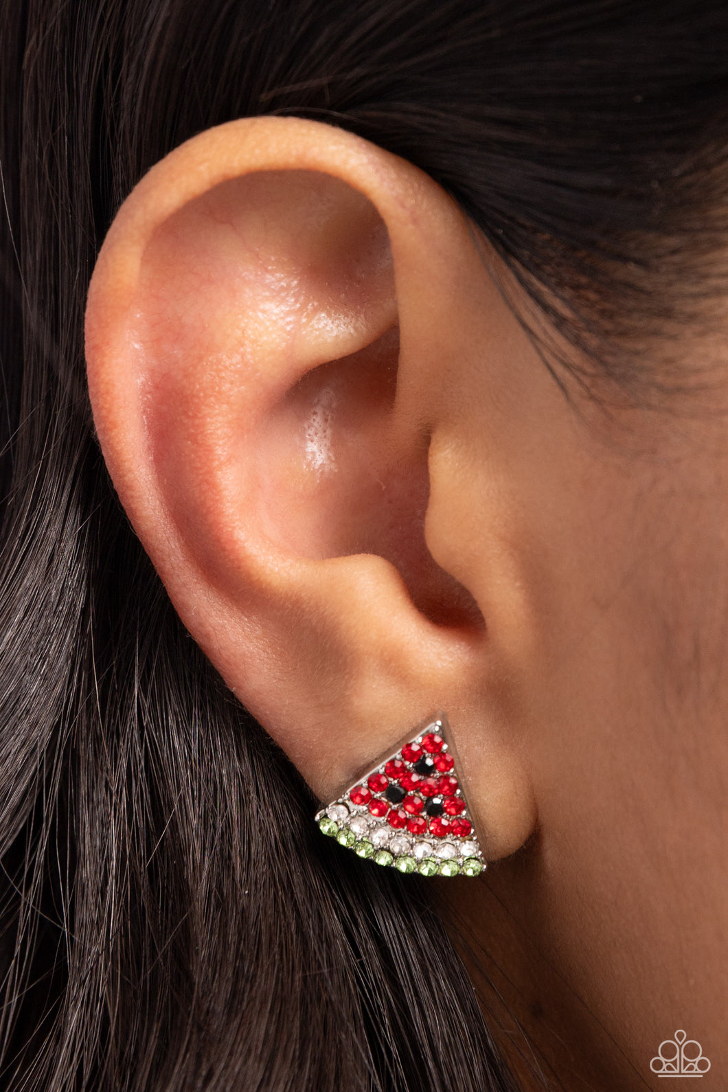 Featuring red, black, white, and green rhinestones, a silver watermelon-inspired post glitters from the ear for a fresh, fruity design. Earring attaches to a standard post fitting. Sold as one pair of post earrings.