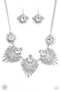 Textured metal bars flare out from a mesmerizing gem, creating a fringe of fanning frames. Sprinkled with matching white rhinestones, the dazzling display falls just below the collar for a sassy Blockbuster finish. Features an adjustable clasp closure.  Sold as one individual necklace. Includes one pair of matching earrings.