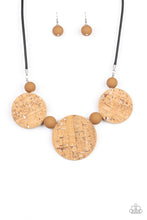 Load image into Gallery viewer, Featuring white accents, cork-like frames and brown matte beads are threaded along an invisible wire below the collar for a statement-making look. Features an adjustable clasp closure.  Sold as one individual necklace. Includes one pair of matching earrings.
