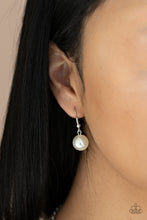 Load image into Gallery viewer, White pearl hanging from a silver fish hook earring.
