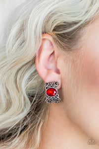 Brushed in an antiqued shimmer, vine-like filigree climbs into a glistening silver hoop. A glittery red rhinestone is pressed into the top of the frame for a regal finish. Earring attaches to a standard clip-on fitting.  Sold as one pair of clip-on earrings.
