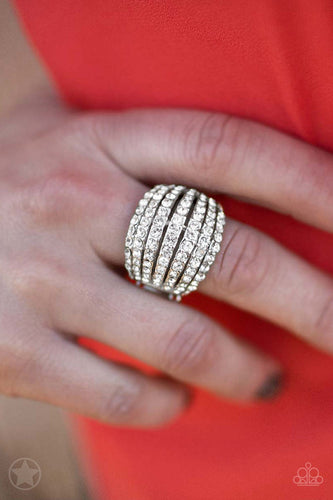 Row after row of incandescent white rhinestones stack into a dazzling display. The gorgeous rounded bands and undeniable sparkle create a regal blockbuster statement piece. Features a stretchy band for a flexible fit. Sold as one individual ring.